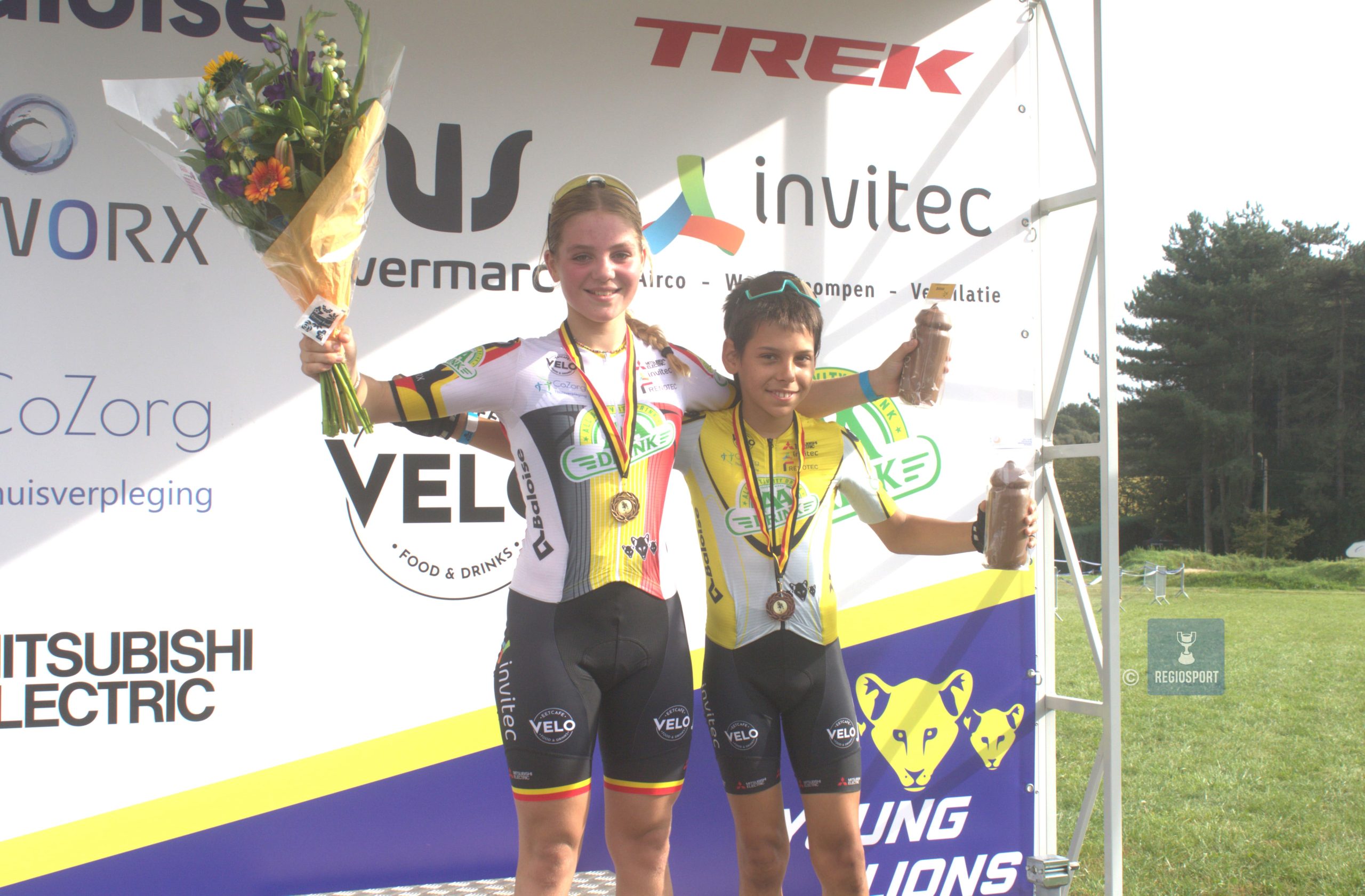 Belgisch kampioene Fia Martino met ploegmaat en provinciaal kampioen Gabriel Hendrickx die overall derde werd